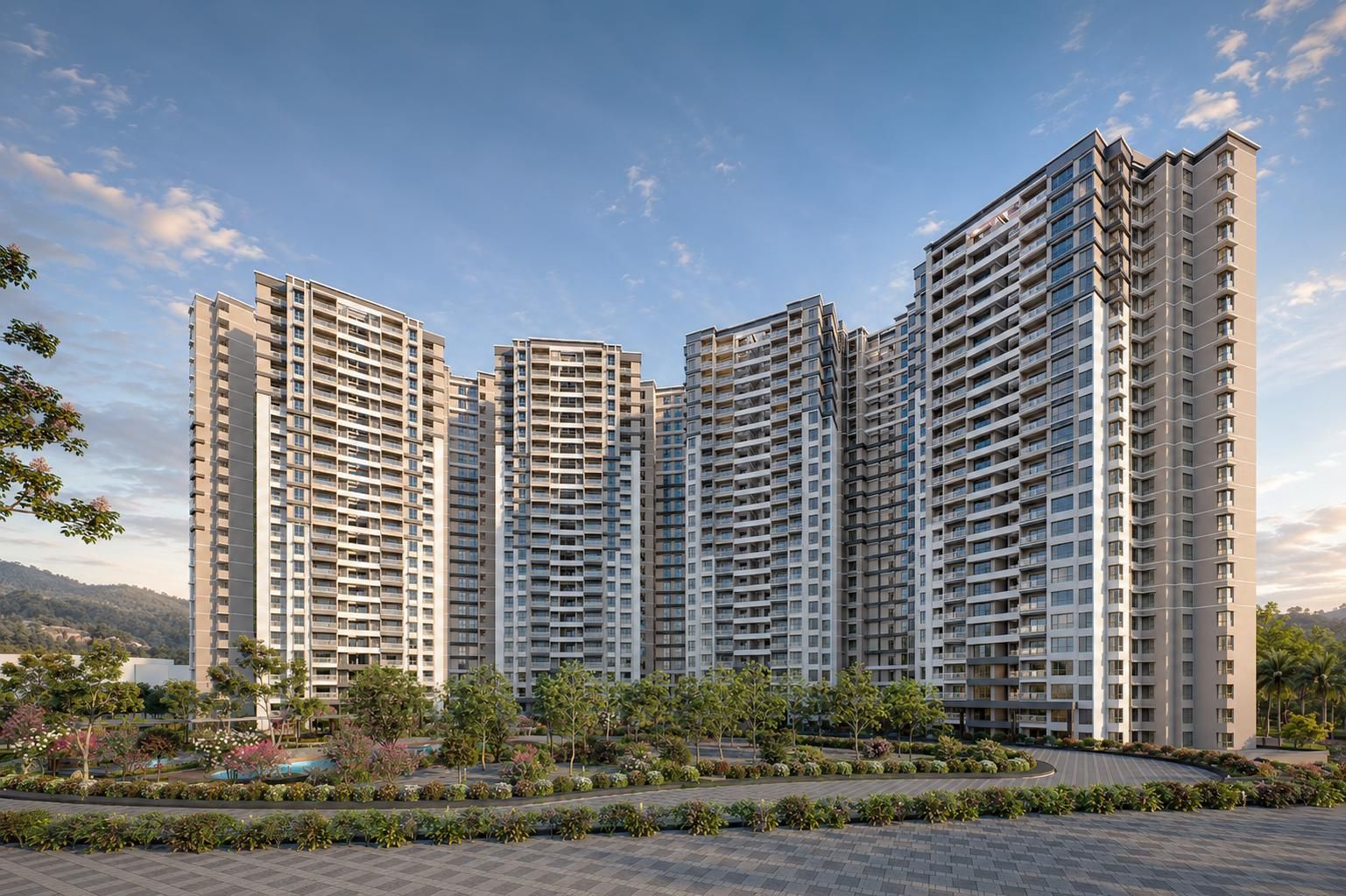 Prestige Parklane towers at dusk, seen from the landscaped entrance at Devanahalli